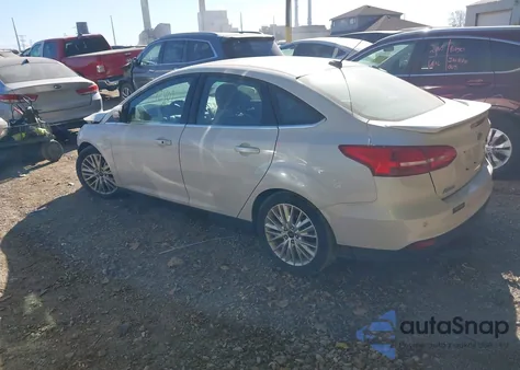 2015 Ford Focus Titanium z USA, uszkodzony, nr VIN 1FADP3J23FL383637